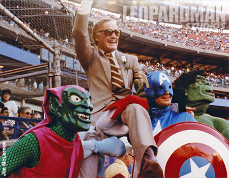 Stan Lee sits on Marvel Superheroes shoulders